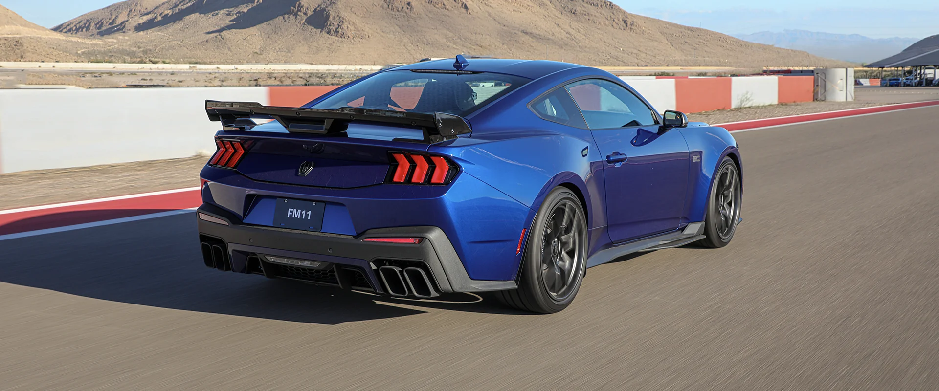 Ford Mustang Dark Horse SC rear three-quarter showing the rear wing