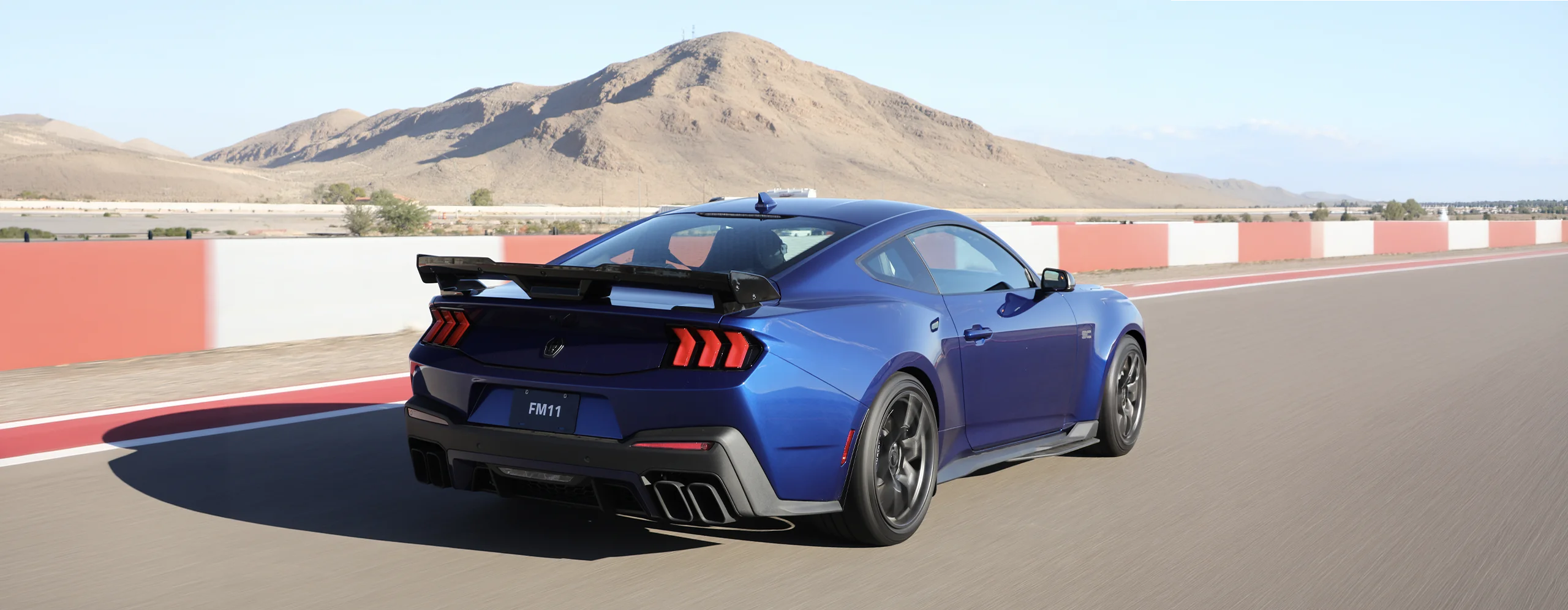 Ford Mustang Dark Horse SC rear three-quarter showing the rear wing
