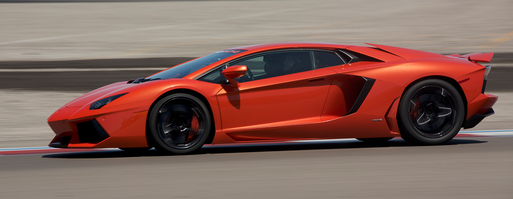 Drive a Lamborghini Supercar on a Professional Racetrack with Exotics Racing